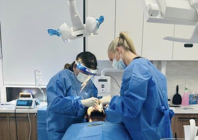 dr rashi gupta doing dental implants procedure on patient dentist norlane geelong