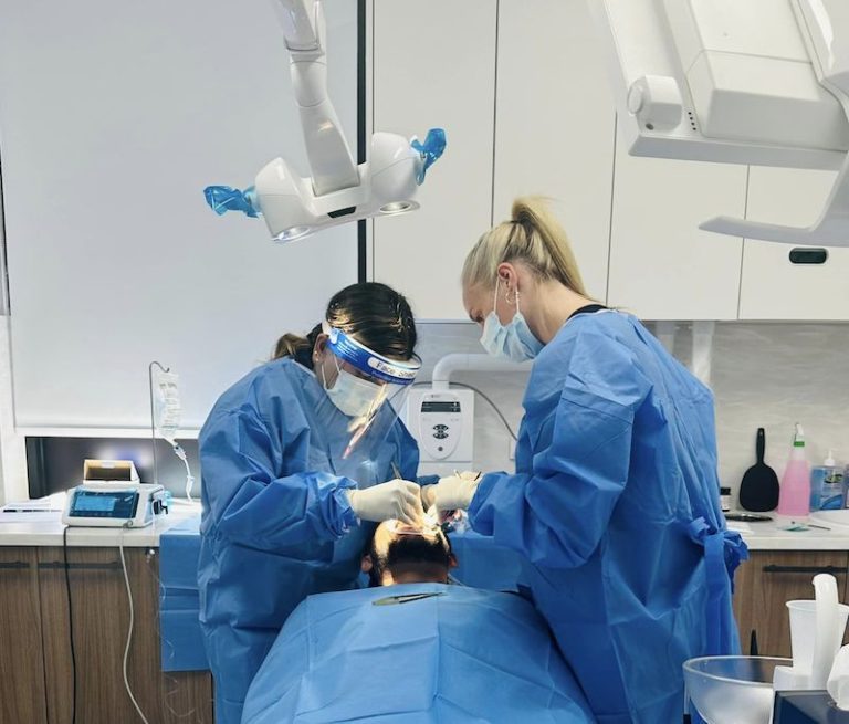 dr rashi gupta doing dental implants procedure on patient dentist norlane geelong