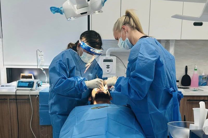 dr-rashi-gupta-doing-dental-implants-procedure-on-patient-dentist-norlane-geelong